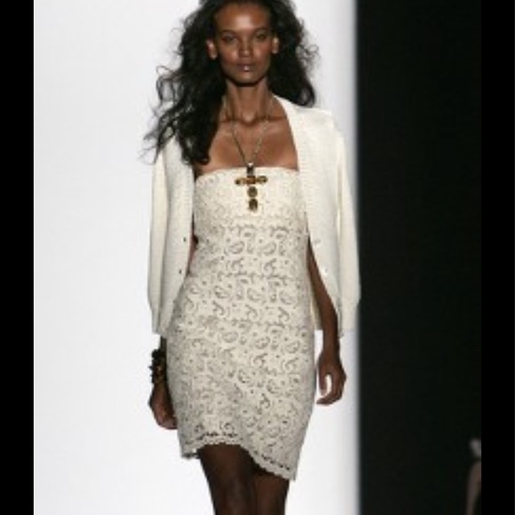 Ivory lace dress by Michael Kors is in like new condition. Size 2 - Picture 16 of 16